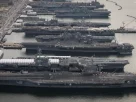 Американські авіаносці USS Dwight D. Eisenhower (CVN 69), USS George H.W. Bush (CVN 77), USS Enterprise (CVN 65), USS Harry S. Truman (CVN 75) та USS Abraham Lincoln (CVN 72) у військово-морській базі Норфолк у штаті Вірджинія.