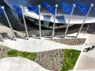 Знімок, зроблений з дрона, показує прапори Європейського Союзу перед будівлею штаб-квартири Європейської комісії, відомою як «Берлемонт», у Брюсселі, Бельгія, 29 квітня 2026 року