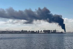 Густі хмари диму над Санкт-Петербургом, де в середу розпочалася економічна конференція.